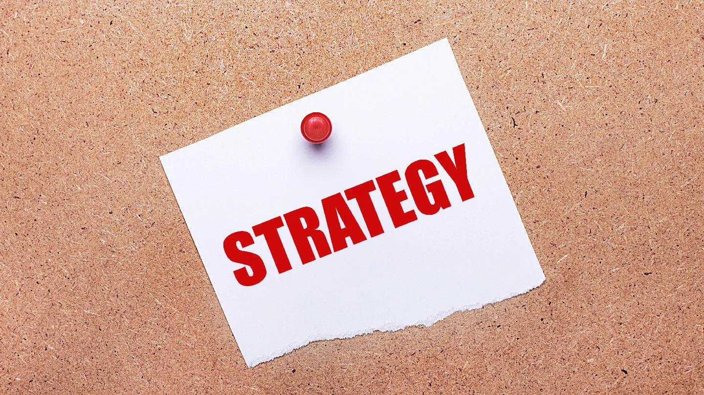Pin - held note with "STRATEGY" text.